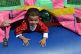 Lemoore's Aden Enriquez looks for parents at Lemoore Kids Day.